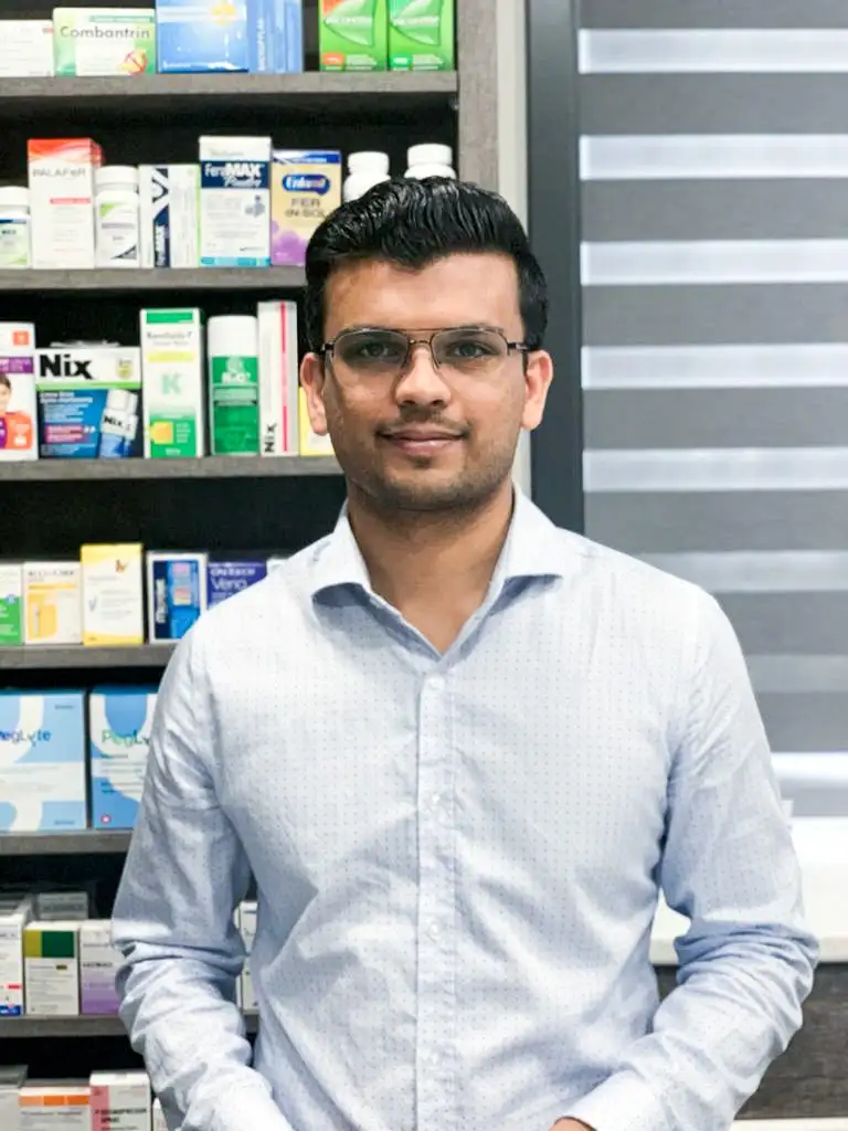 Head pharmacist Nimmit Vyas standing in the pharmacy